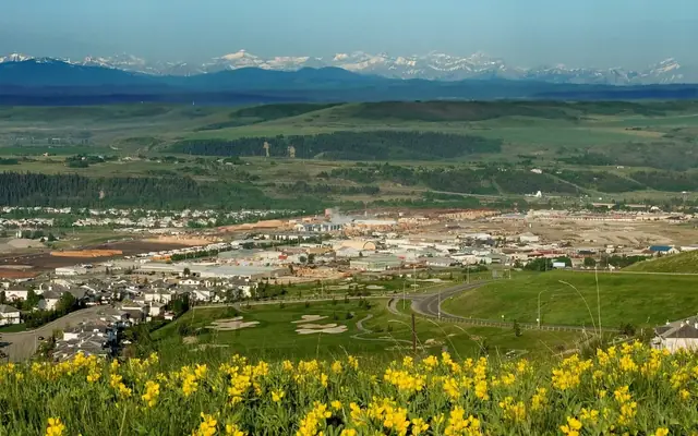 View west over Cochrane from the Glen Eagles hillside toward the Rocky Mountains